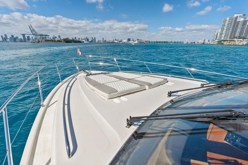 Slide: The Image of 2016 Princess 60 Flybridge Motor Yacht cruising near city skyline on a sunny day. - 55