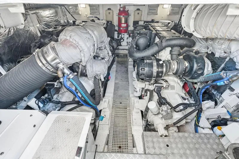 Slide: The Image of Engine room of 2016 Princess 60 Flybridge Motor Yacht, showcasing dual engines and equipment. - 63