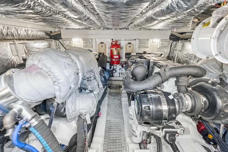 Slide: The Image of Engine room of 2016 Princess 60 Flybridge Motor Yacht, showcasing machinery and equipment. - 64