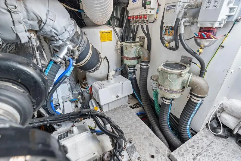 Slide: The Image of Engine room of 2016 Princess 60 Flybridge Motor Yacht with visible machinery and piping. - 66
