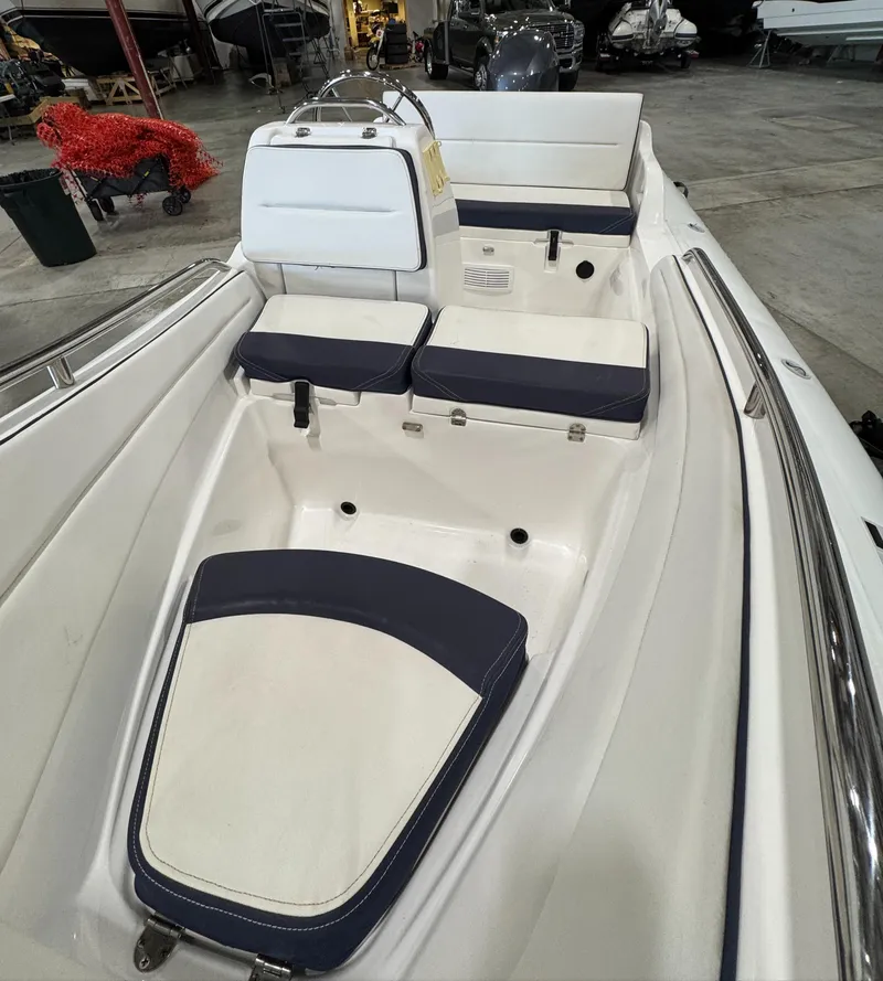 Slide: The Image of 2018 AB Inflatables Nautilus 12 DLX boat interior with white and navy seating. - 11