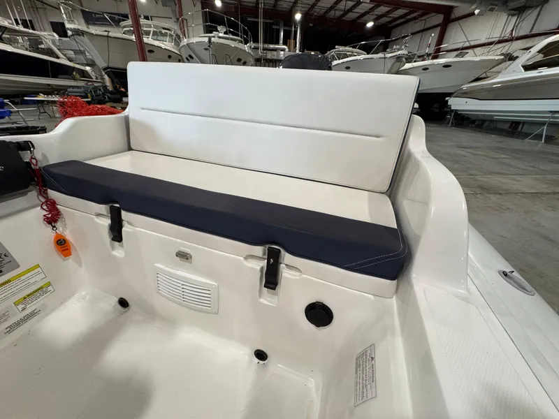 Slide: The Image of 2018 AB Inflatables Nautilus 12 DLX boat interior with cushioned seating in a showroom. - 15