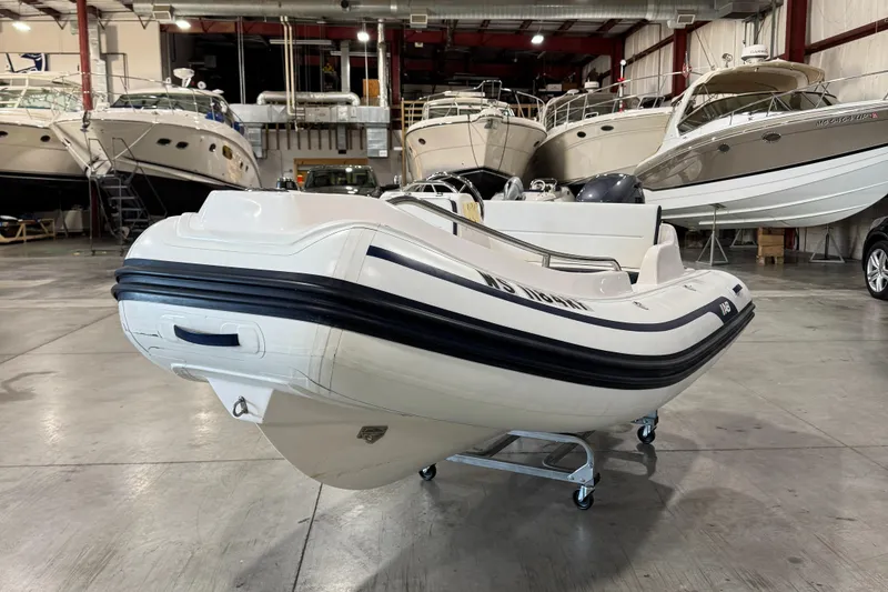 Slide: The Image of 2018 AB Inflatables Nautilus 12 DLX boat in a showroom with other yachts. - 3
