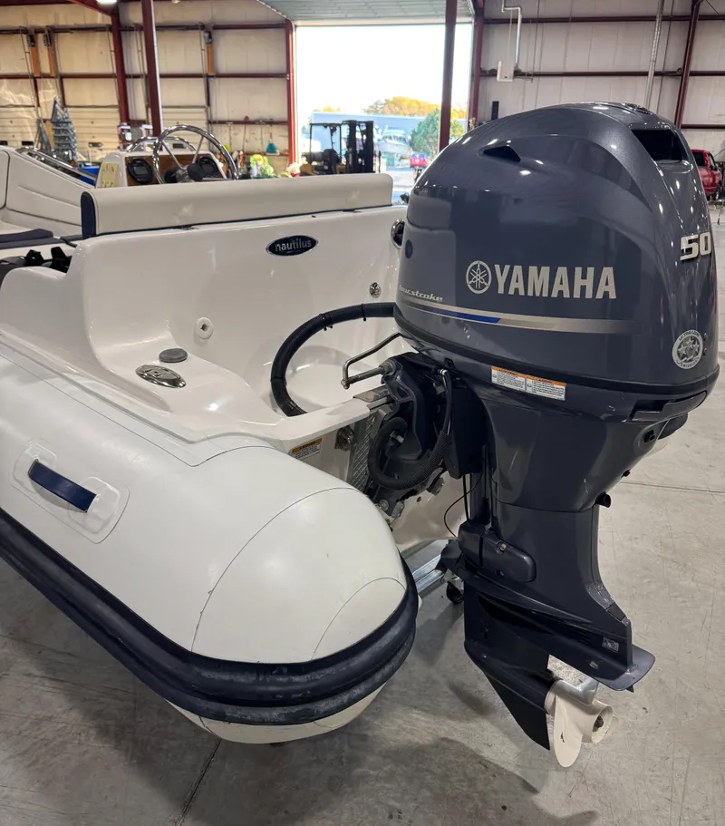 Slide: The Image of 2018 AB Inflatables Nautilus 12 DLX with Yamaha 50 outboard motor in a warehouse. - 6