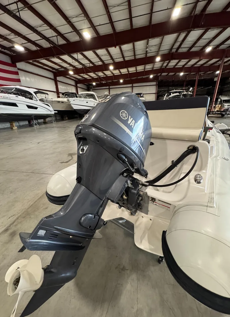 Slide: The Image of 2018 AB Inflatables Nautilus 12 DLX with Yamaha outboard in a boat showroom. - 9