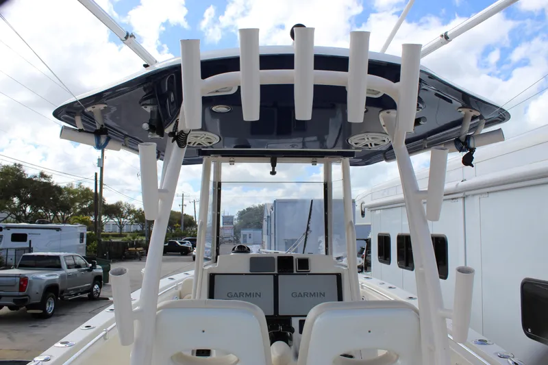 Slide: The Image of 2019 Cobia 301 Center Console boat with Garmin electronics, viewed from the rear. - 30