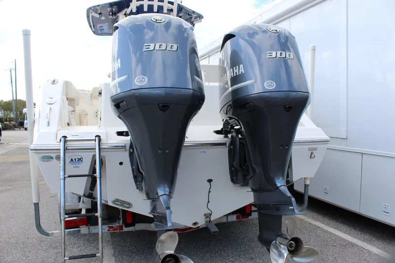 Slide: The Image of 2019 Cobia 301 Center Console with twin Yamaha 300 engines, rear view. - 8