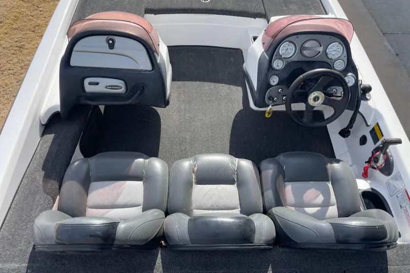 Slide: The Image of Interior of a 2008 Nitro NX 898 DC boat with steering console. - 6