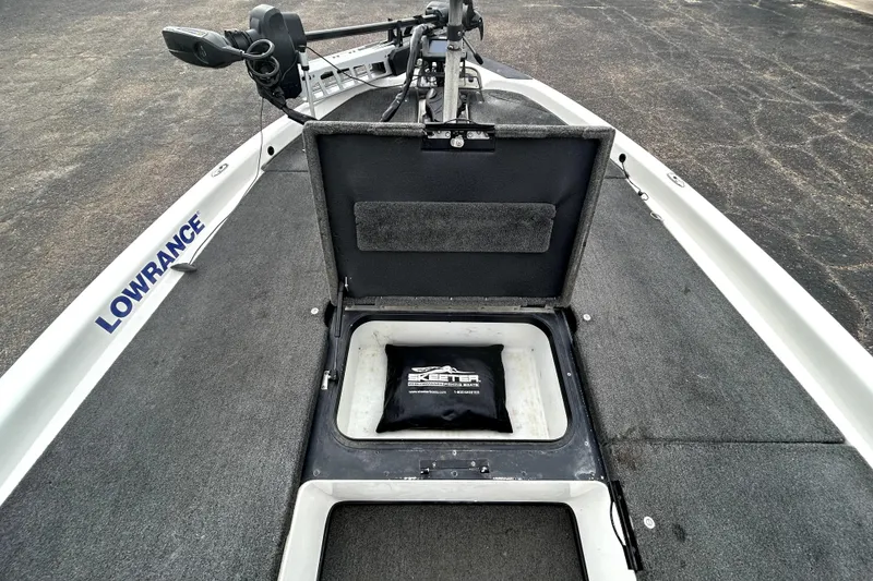Slide: The Image of 2014 Skeeter TZX195 boat deck with Lowrance equipment and storage compartment open. - 13