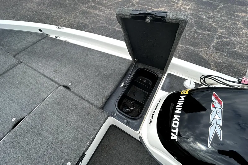 Slide: The Image of 2014 Skeeter TZX195 boat deck with Minn Kota motor and storage compartment. - 19