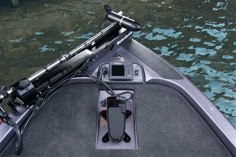 Slide: The Image of 2014 Skeeter TZX195 boat on trailer in parking lot under cloudy sky. - 2