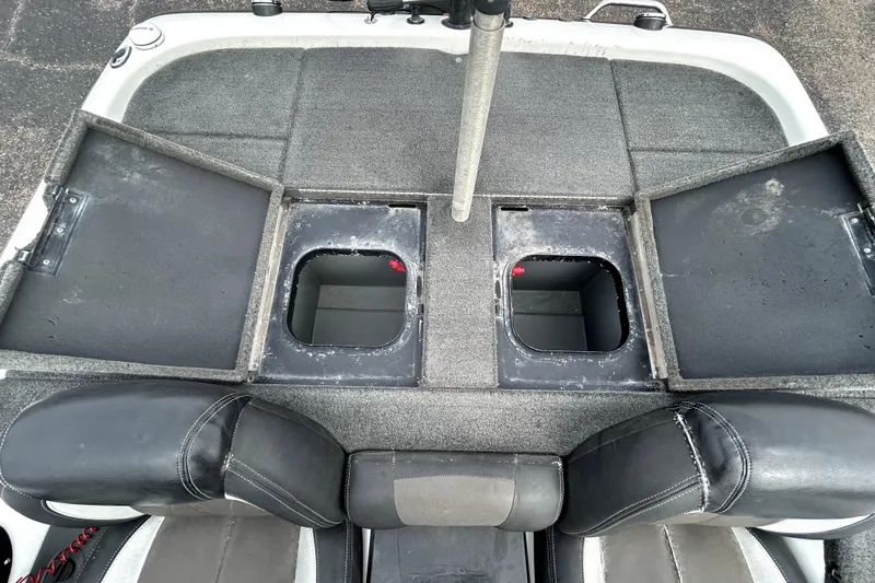 Slide: The Image of 2014 Skeeter TZX195 boat with open storage compartments and seats. - 31