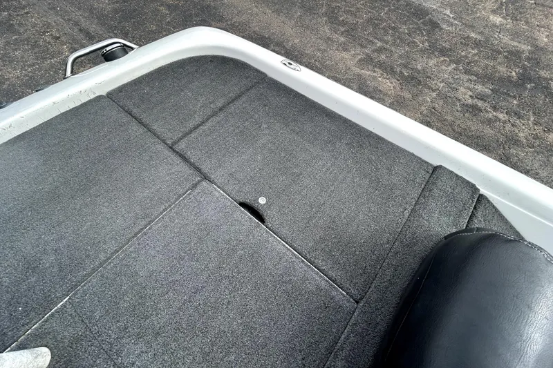 Slide: The Image of 2014 Skeeter TZX195 boat deck with gray carpet. - 32