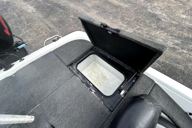 Slide: The Image of Open storage compartment on 2014 Skeeter TZX195 boat deck. - 33