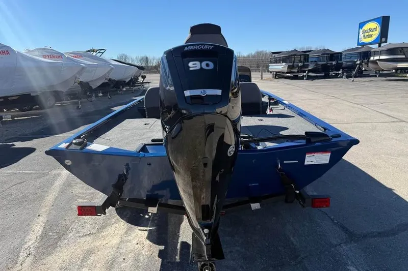 Slide: The Image of 2026 Lowe Stinger 175C boat with Mercury 90 engine in outdoor showroom. - 6
