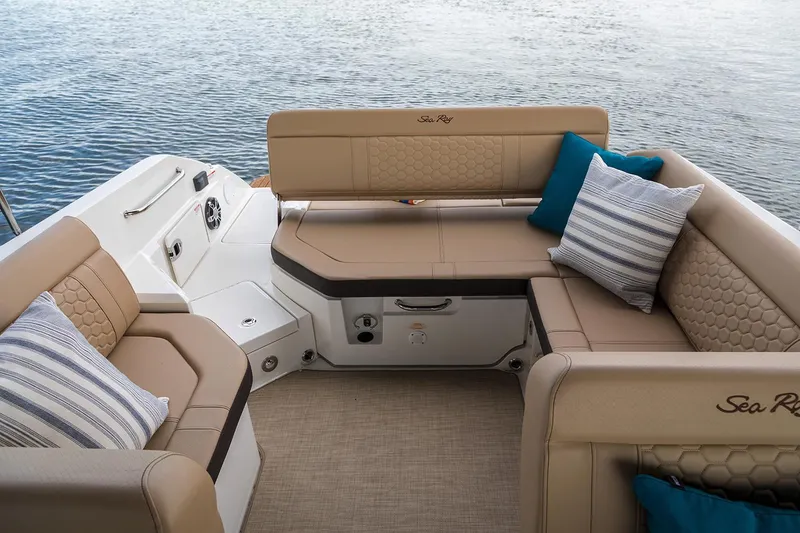 Slide: The Image of Manufacturer Provided Image: 2020 Sea Ray SDX 250 Outboard boat interior with tan seating and blue pillows. - 10