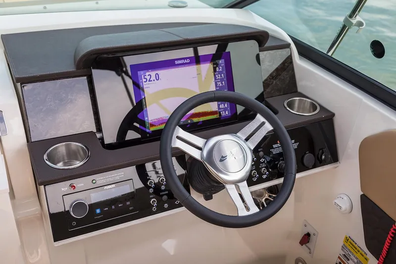 Slide: The Image of Manufacturer Provided Image: 2020 Sea Ray SDX 250 Outboard helm with steering wheel and navigation display. - 8