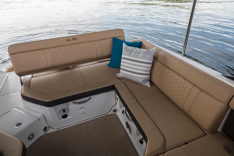 Slide: The Image of Manufacturer Provided Image: 2020 Sea Ray SDX 250 Outboard boat interior with tan seating and decorative pillows. - 9