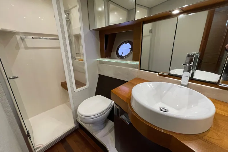 Slide: The Image of Luxurious bathroom in 2016 Tiara Yachts C44 Coupe with modern fixtures and elegant design. - 15