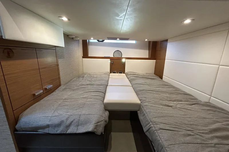 Slide: The Image of Luxurious cabin interior of 2016 Tiara Yachts C44 Coupe with twin beds and modern design. - 16