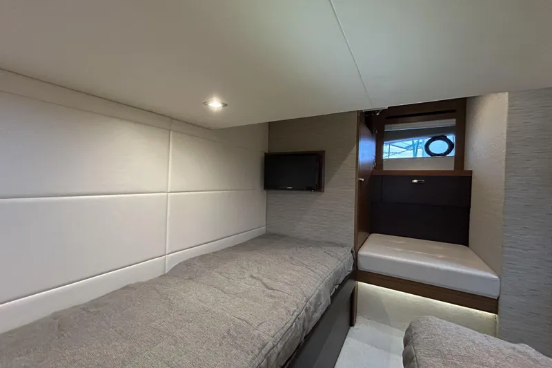 Slide: The Image of Interior cabin of 2016 Tiara Yachts C44 Coupe with modern design and cozy bedding. - 17