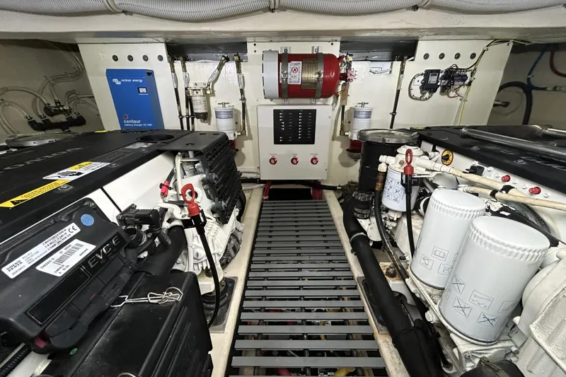 Slide: The Image of Engine room of 2016 Tiara Yachts C44 Coupe, showcasing mechanical components and systems. - 19