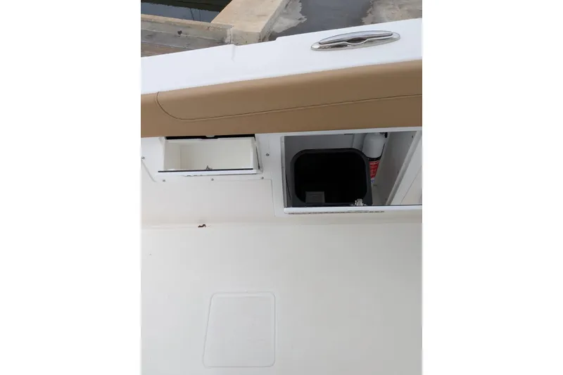Slide: The Image of 2026 Caymas 30 CT boat battery compartment with multiple batteries and wiring. - 13