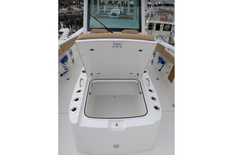 Slide: The Image of 2026 Caymas 30 CT boat with open storage compartment on deck. - 7