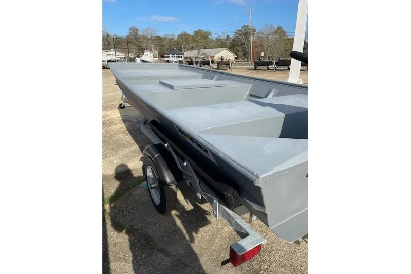 The Image of 2024 Southfork 1242 boat on trailer, parked outdoors, showcasing sleek design and spacious interior. - 1