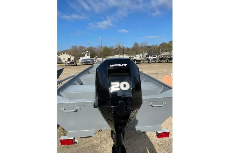 Slide: The Image of 2024 Southfork 1242 boat with Mercury 20 horsepower outboard motor in a sunny outdoor setting. - 6