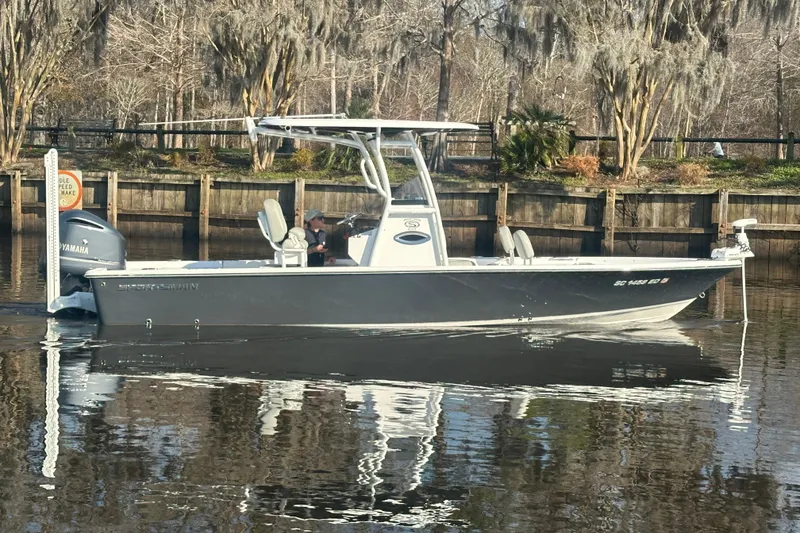 The Image of 2020 Sportsman Masters 247 Bay Boat on calm water, featuring Yamaha engine. - 1