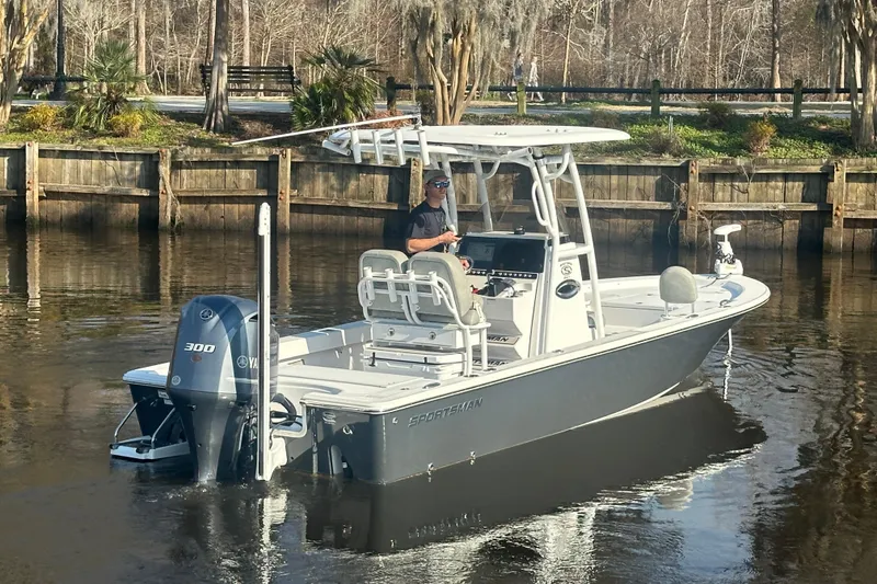 Slide: The Image of 2020 Sportsman Masters 247 Bay Boat on calm water, featuring a Yamaha 300 engine. - 12