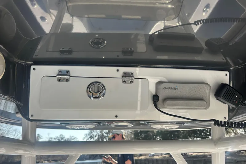 Slide: The Image of 2020 Sportsman Masters 247 Bay Boat console with Garmin device and storage compartment. - 14