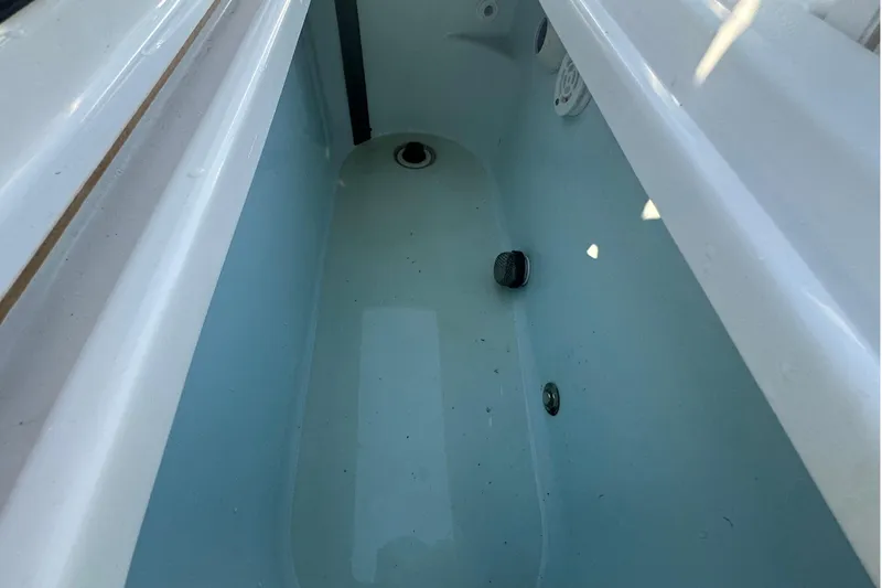 Slide: The Image of Livewell compartment in a 2020 Sportsman Masters 247 Bay Boat, featuring clean interior. - 19