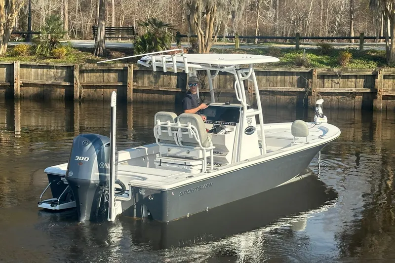 Slide: The Image of 2020 Sportsman Masters 247 Bay Boat on calm water, featuring Yamaha 300 engine. - 2