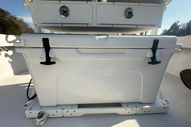 Slide: The Image of 2020 Sportsman Masters 247 Bay Boat with white cooler and storage compartment. - 22