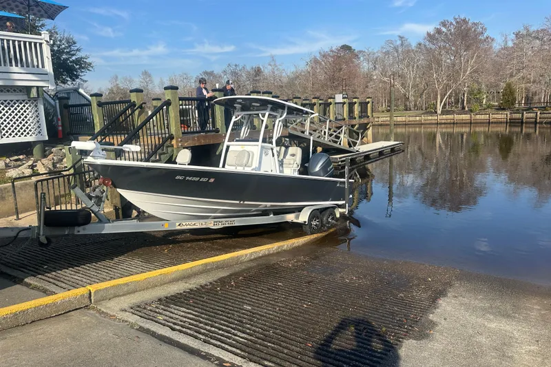 Slide: The Image of 2020 Sportsman Masters 247 Bay Boat on trailer at boat ramp, ready for launch. - 3