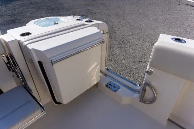 Slide: The Image of 2024 Sailfish 312 CC boat interior with seating and storage compartments. - 14