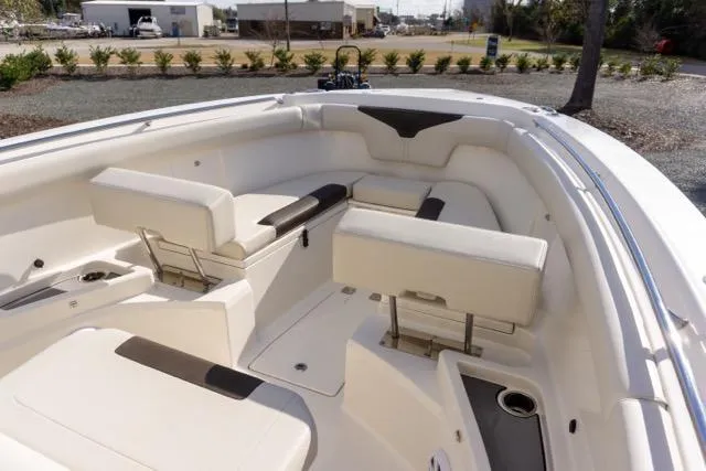 Slide: The Image of 2024 Sailfish 312 CC boat interior with white seating and modern design. - 27