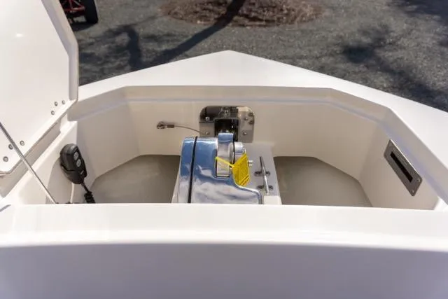 Slide: The Image of 2024 Sailfish 312 CC boat anchor compartment with winch and control panel. - 39