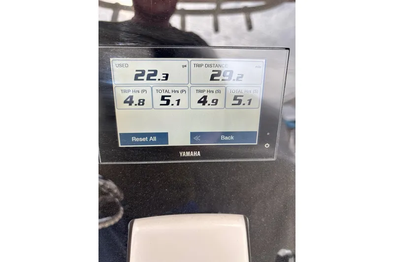 Slide: The Image of Yamaha display showing fuel usage and trip data on 2024 Sailfish 312 CC boat. - 4