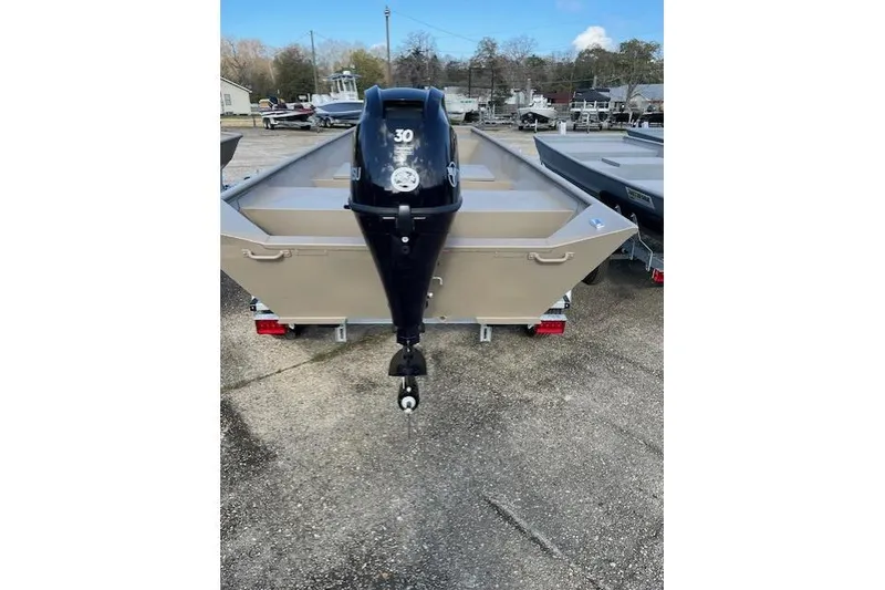 Slide: The Image of 2025 Weldcraft 1448 boat with outboard motor, parked on a trailer. - 4