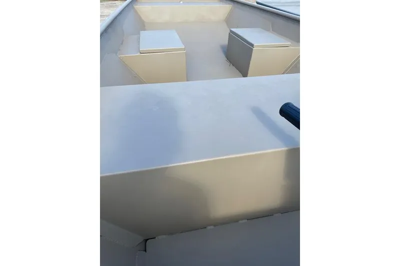 Slide: The Image of 2025 Weldcraft 1448 boat interior with storage compartments and seating. - 7