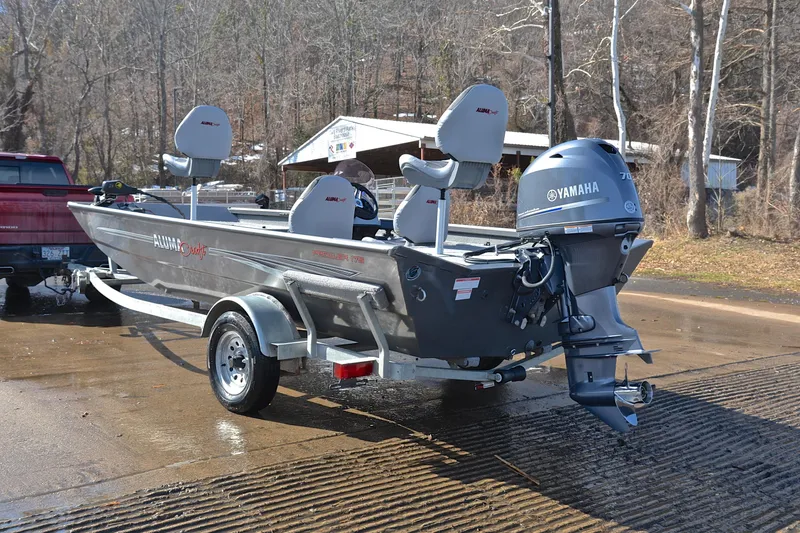 Slide: The Image of 2020 Alumacraft Prowler 175 boat with Yamaha motor on trailer at boat ramp. - 12
