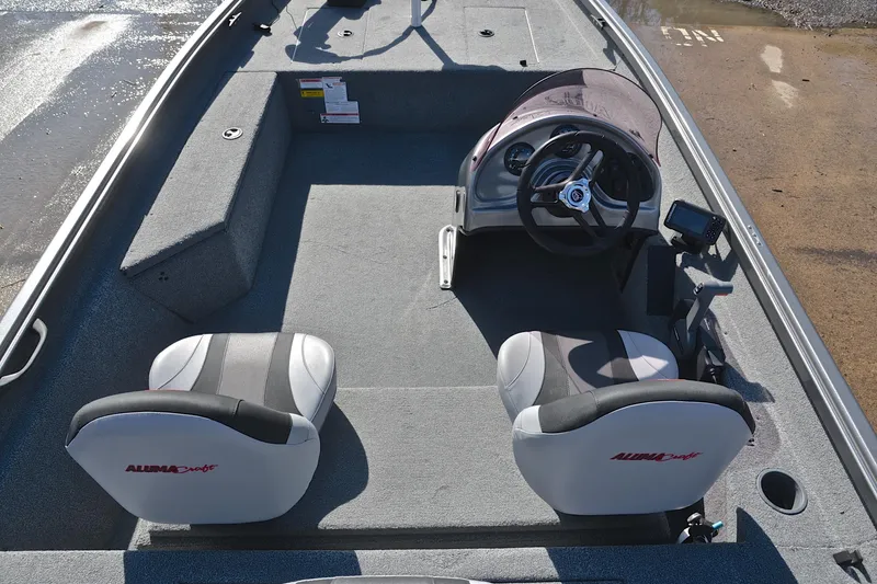 Slide: The Image of 2020 Alumacraft Prowler 175 boat interior with steering wheel and seating. - 20
