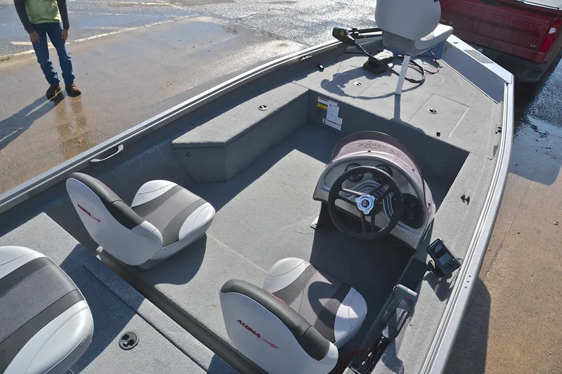 Slide: The Image of 2020 Alumacraft Prowler 175 boat interior with steering wheel and seating. - 23