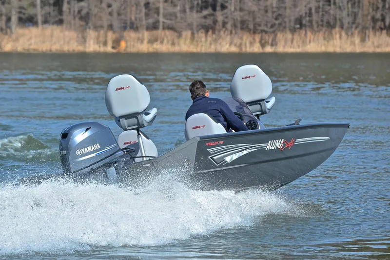 Slide: The Image of 2020 Alumacraft Prowler 175 boat with Yamaha engine on a lake. - 5