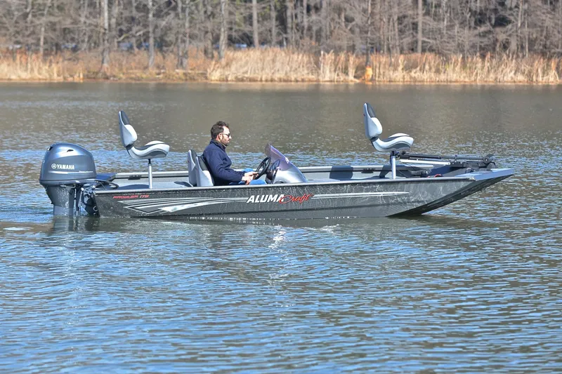 Slide: The Image of 2020 Alumacraft Prowler 175 boat on a calm lake with Yamaha motor. - 7
