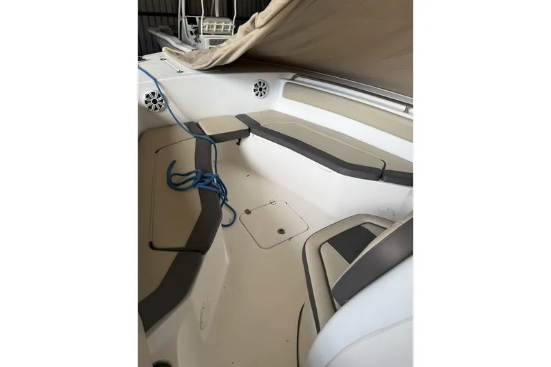 Slide: The Image of 2018 Tidewater 252 CC Adventure boat interior with seating and blue rope. - 10