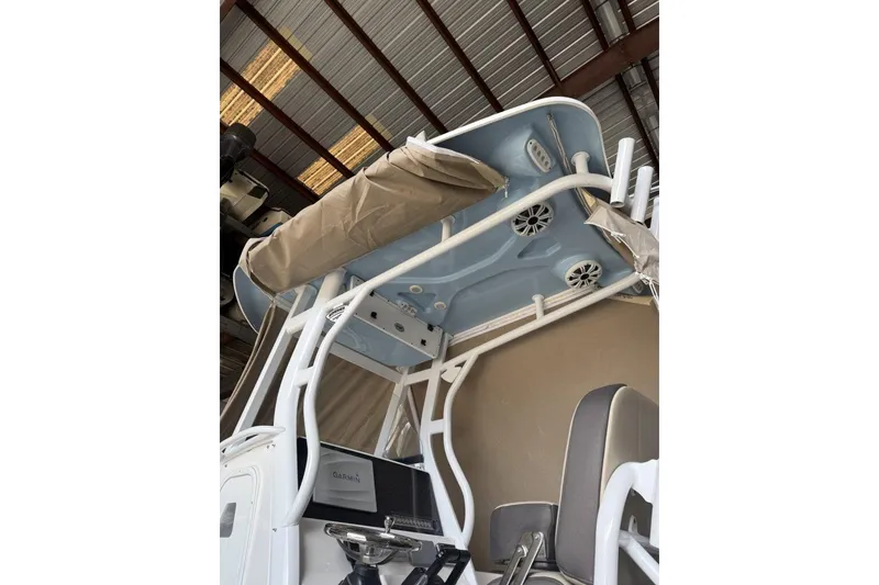Slide: The Image of 2018 Tidewater 252 CC Adventure boat interior with speakers and canopy. - 3